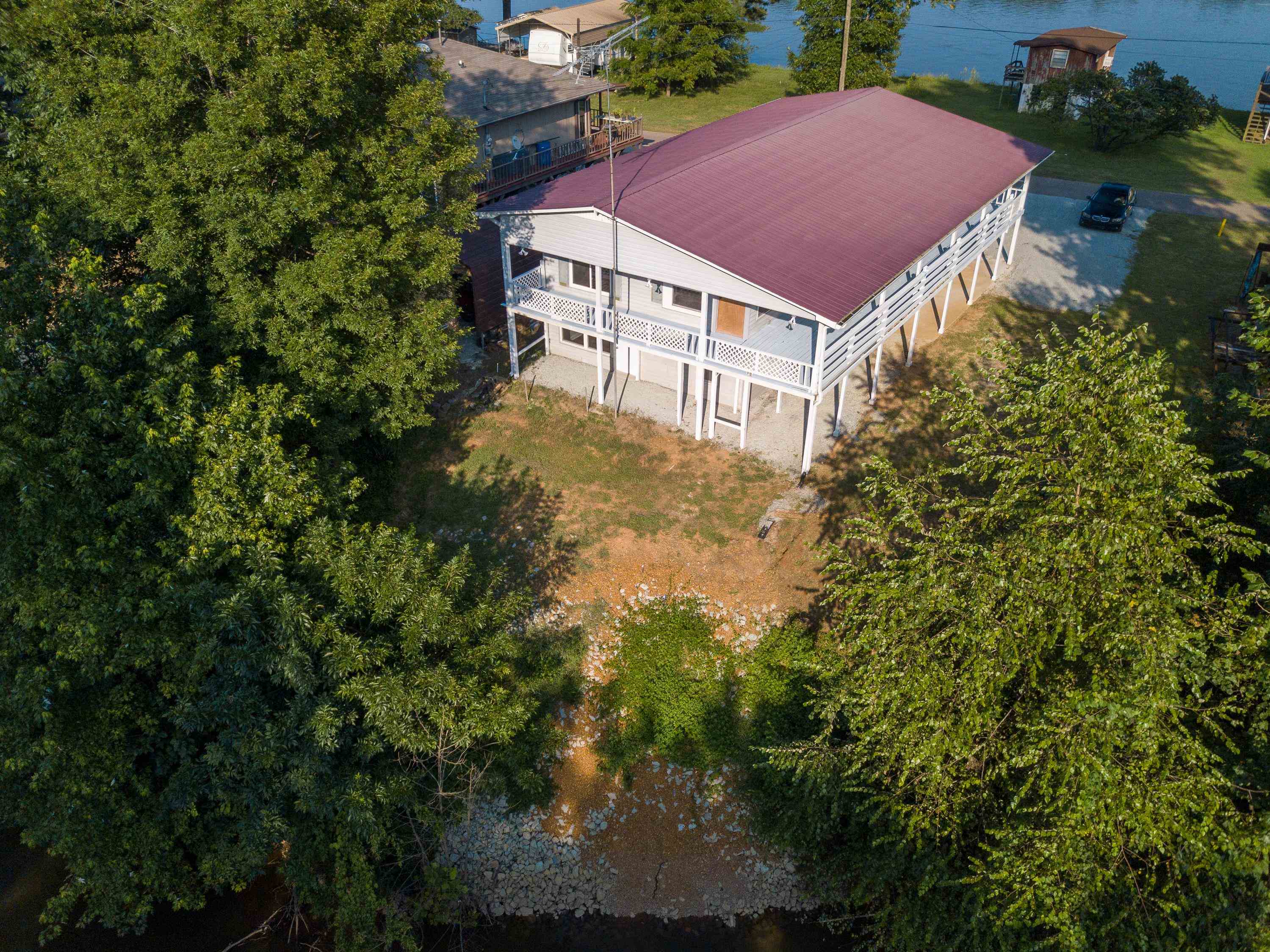 70 Point Way Saltillo, TN 38370 - Photo 3 of 36 a view of a house with a yard plants and large tree