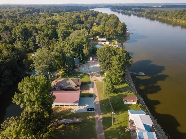 aerial view of a house with a lake view