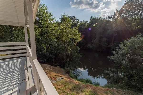 a view of balcony and yard