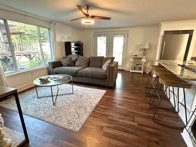 70 Point Way Saltillo, TN 38370 - Photo 10 of 36 Living room with dark hardwood / wood-style flooring, ceiling fan, ornamental molding, and a wealth of natural light