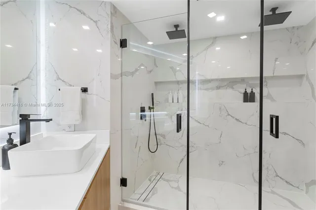 a bedroom with a bed chair and a window