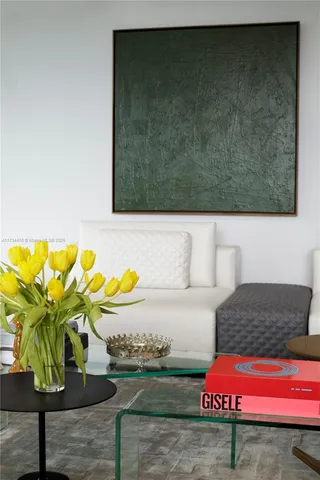 a living room with furniture and a floor to ceiling window