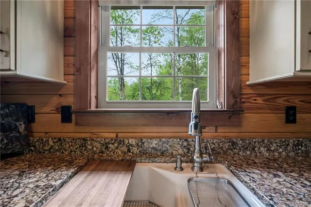 a view of a sink and a window