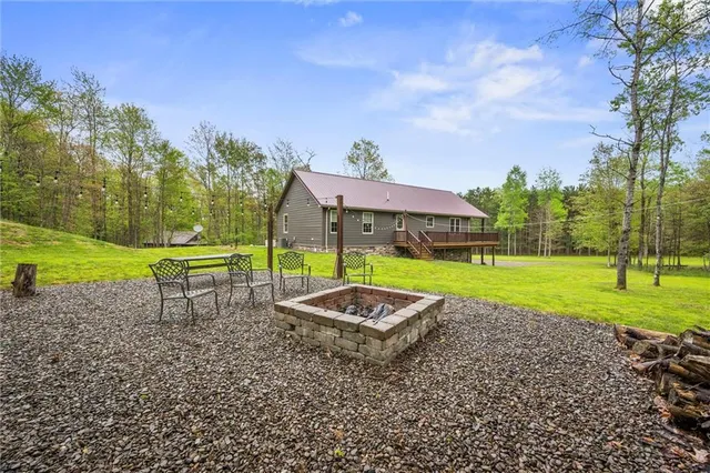a view of a garden with a table and chairs