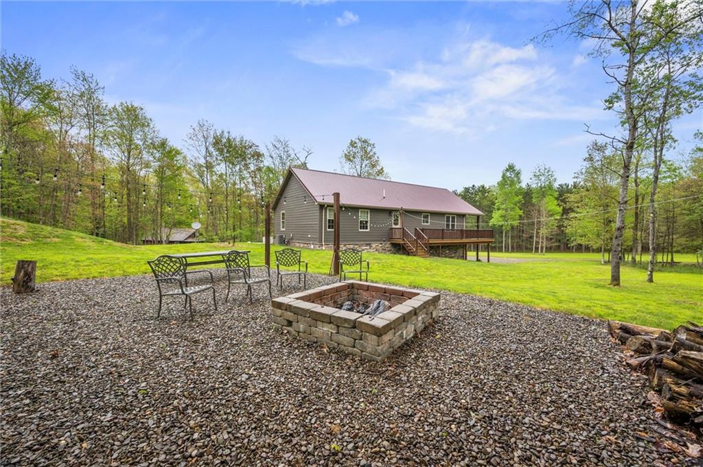 7191 Loleta Road Sigel, PA 15860 - Photo 35 of 47 a view of a garden with a table and chairs