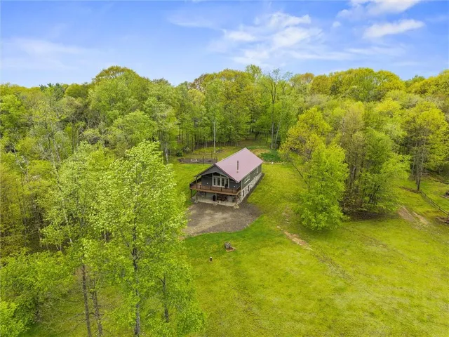a backyard of a house with lots of green space