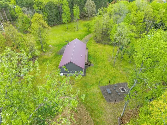 a view of a garden with a swimming pool