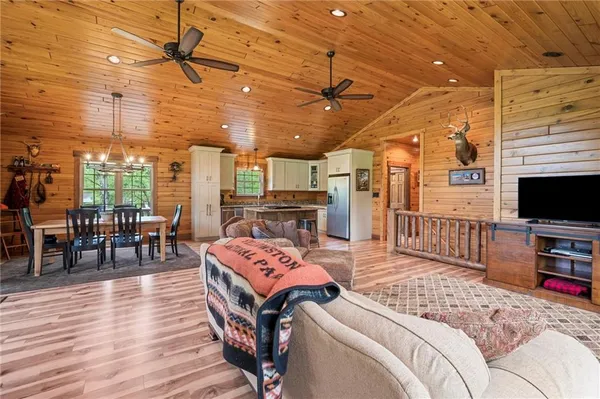 a bedroom with furniture and a flat screen tv