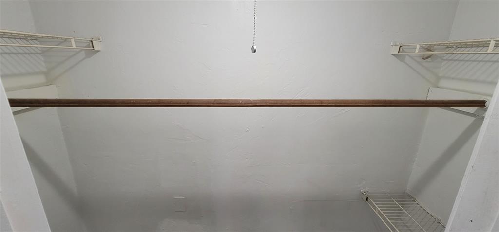 3120 Southwest 26th Terrace Gainesville, FL 32608 - Photo 24 of 25 a view of a room with racks on the wall