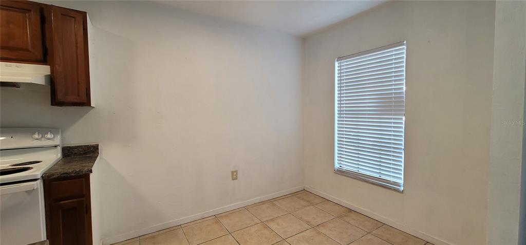 3120 Southwest 26th Terrace Gainesville, FL 32608 - Photo 6 of 25 a view of a kitchen and a window