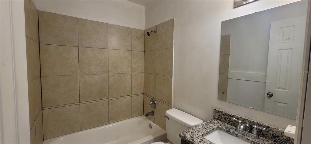 3120 Southwest 26th Terrace Gainesville, FL 32608 - Photo 7 of 25 a bathroom with a sink and toilet