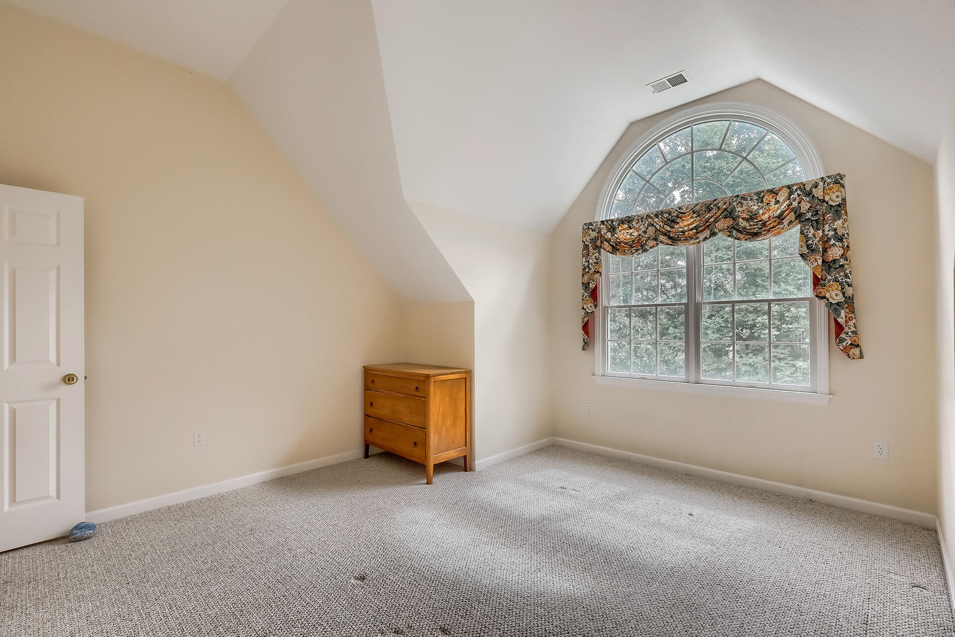 415 Shootflying Hill Road Centerville, MA 02632 - Photo 14 of 37 an empty room with a fireplace and a window