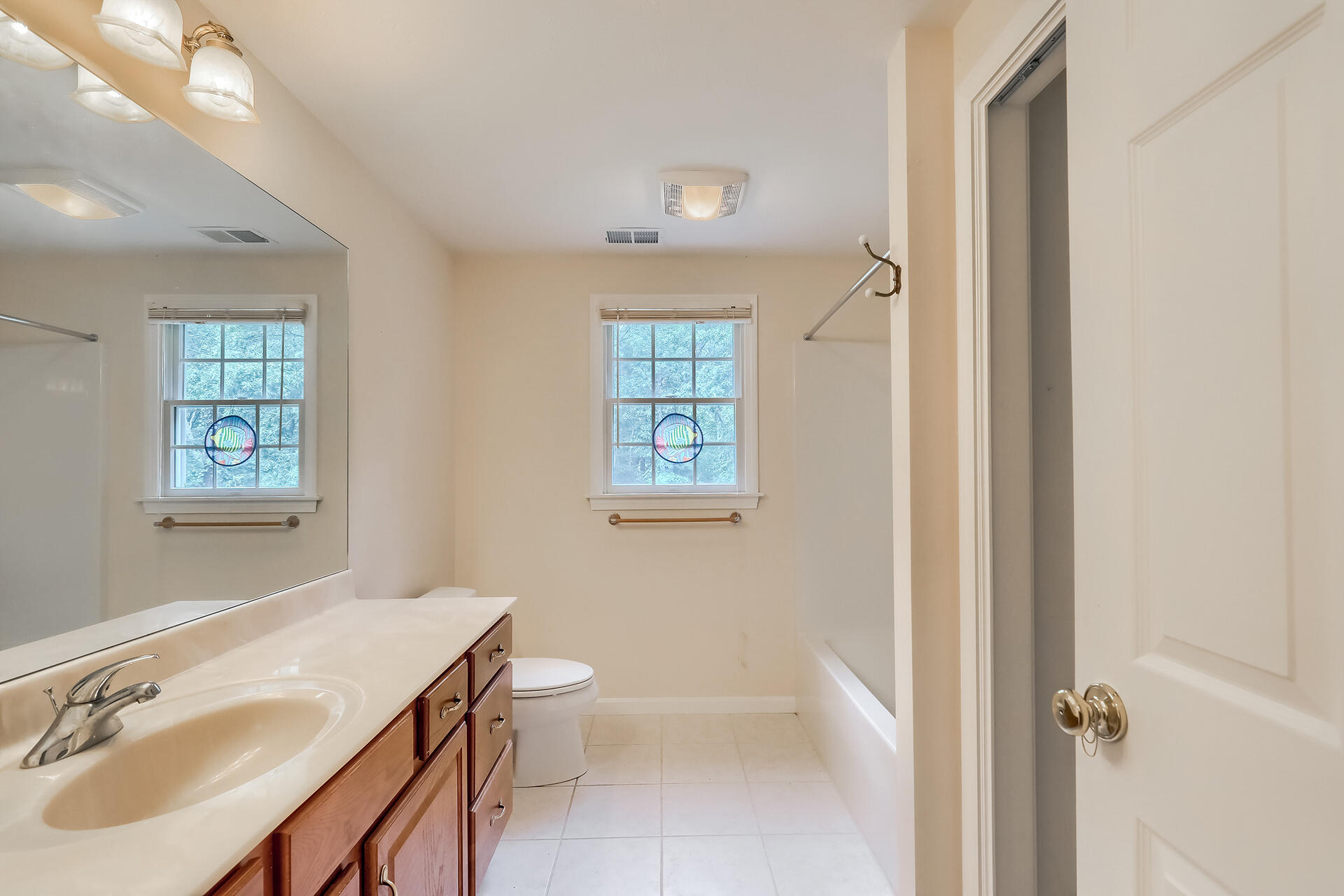415 Shootflying Hill Road Centerville, MA 02632 - Photo 16 of 37 a bathroom with a sink toilet and shower