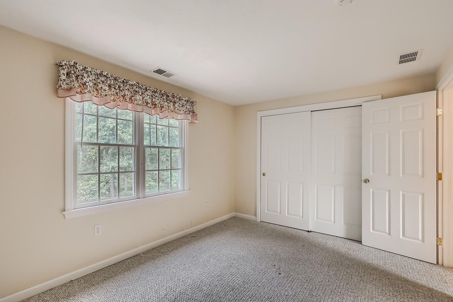 415 Shootflying Hill Road Centerville, MA 02632 - Photo 18 of 37 a view of an empty room with a window