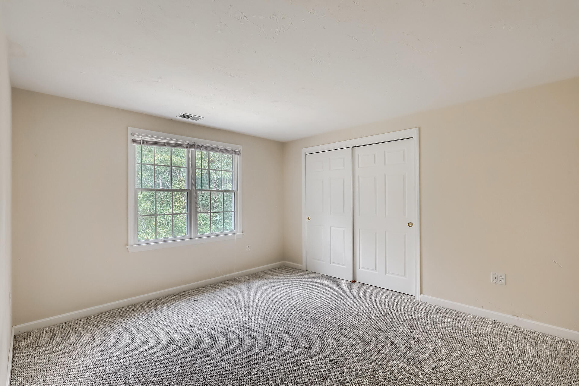 415 Shootflying Hill Road Centerville, MA 02632 - Photo 19 of 37 an empty room with a window