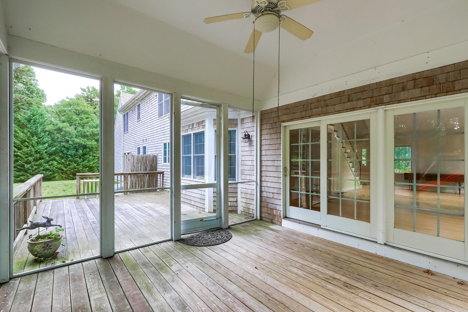 415 Shootflying Hill Road Centerville, MA 02632 - Photo 24 of 37 a view of an empty room with wooden floor and a window