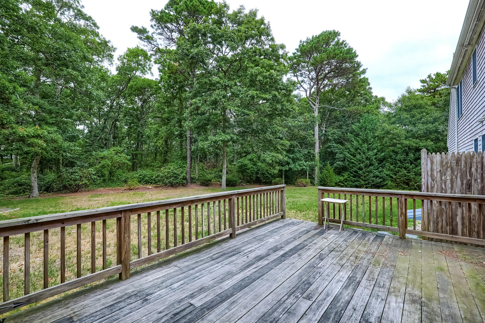 415 Shootflying Hill Road Centerville, MA 02632 - Photo 28 of 37 a view of deck with wooden floor and fence
