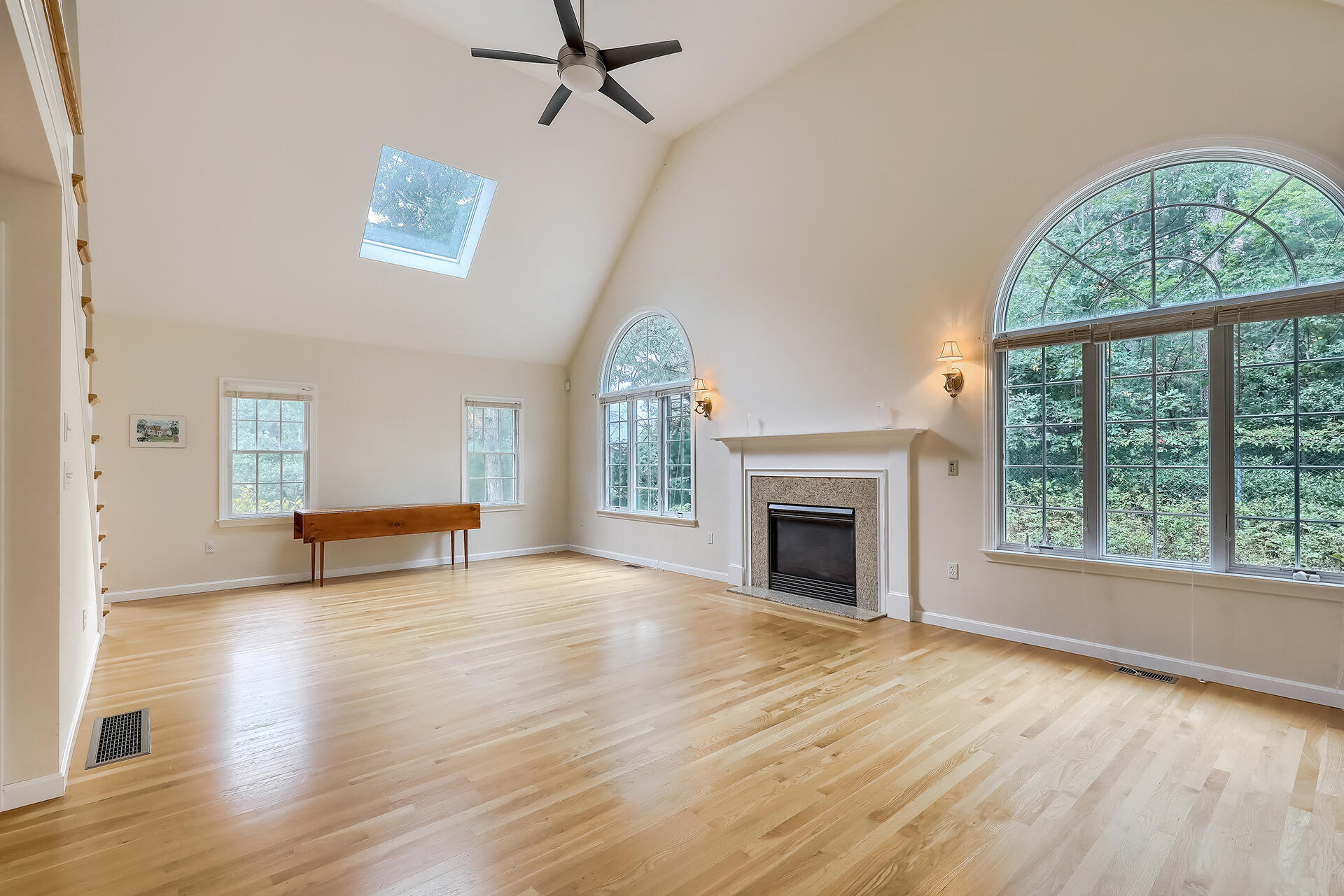 415 Shootflying Hill Road Centerville, MA 02632 - Photo 3 of 37 wooden floor fireplace and windows in an empty room