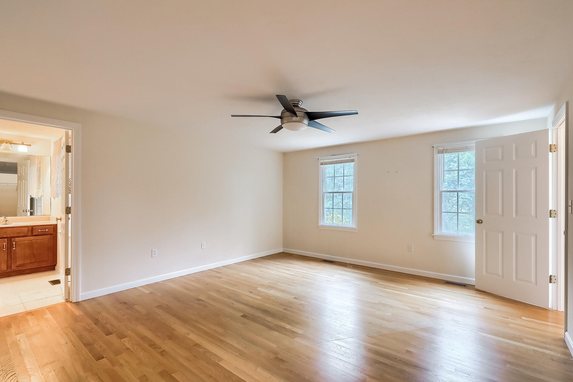 415 Shootflying Hill Road Centerville, MA 02632 - Photo 7 of 37 wooden floor in an empty room with a window