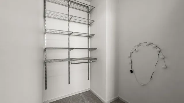 a bathroom with a granite countertop sink a toilet and a mirror