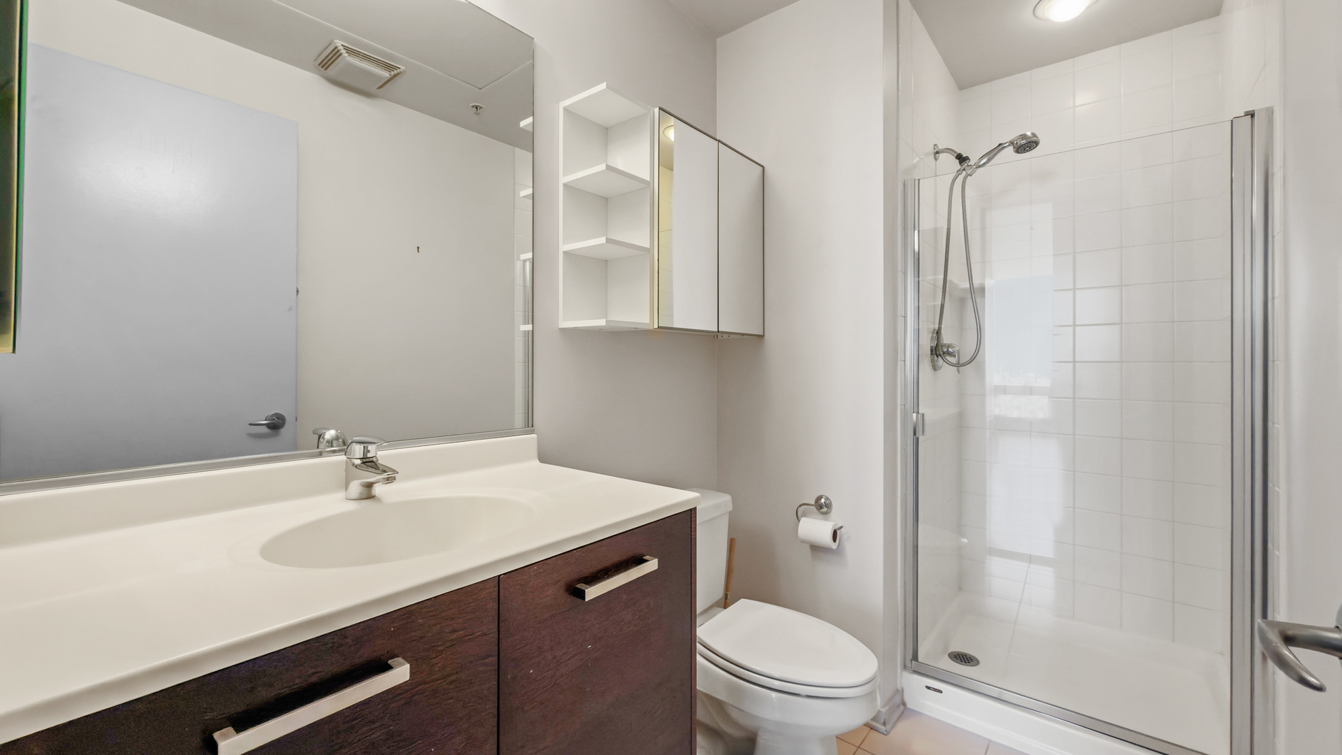 500 West Superior Street, Unit 2002 Chicago, IL 60654 - Photo 16 of 27 a bathroom with a sink toilet and shower