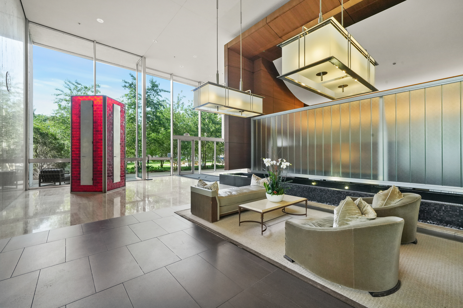 500 West Superior Street, Unit 2002 Chicago, IL 60654 - Photo 25 of 27 a living room with couches a table and chairs with potted plants