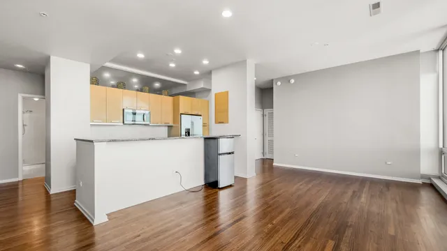 a kitchen with stainless steel appliances granite countertop a sink and cabinets