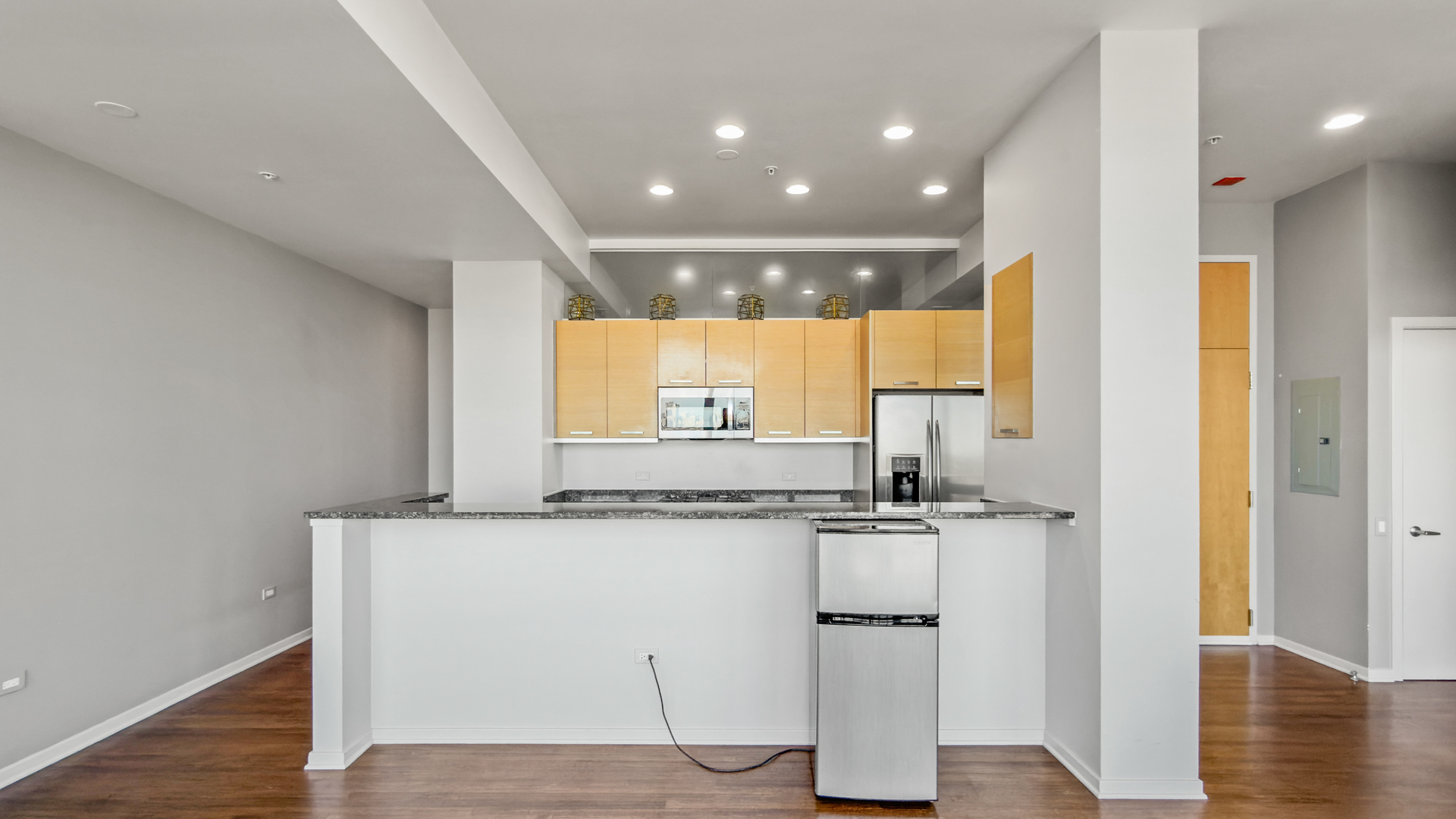 500 West Superior Street, Unit 2002 Chicago, IL 60654 - Photo 6 of 27 a kitchen with stainless steel appliances granite countertop a sink and cabinets