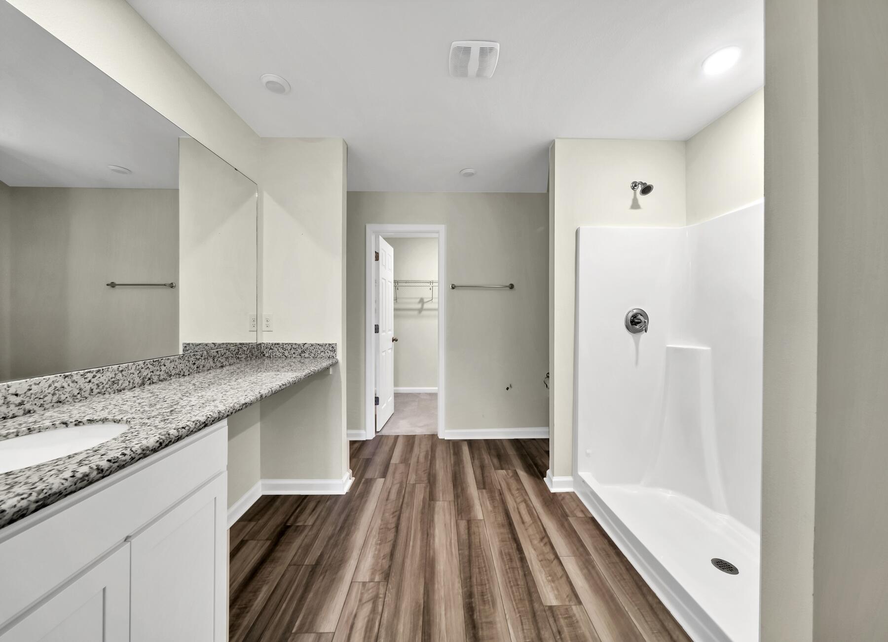10 Riverwalk Crossing Freeport, FL 32439 - Photo 16 of 35 a bathroom with a granite countertop sink toilet and shower