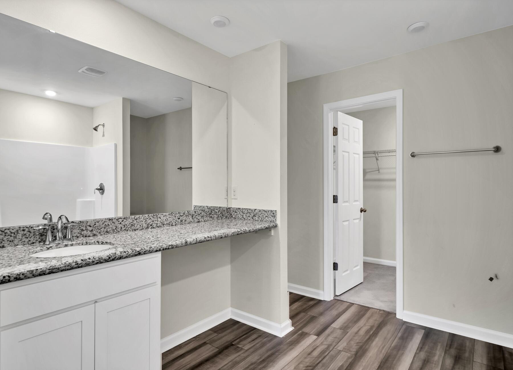 10 Riverwalk Crossing Freeport, FL 32439 - Photo 17 of 35 a bathroom with a granite countertop double vanity sink and mirror