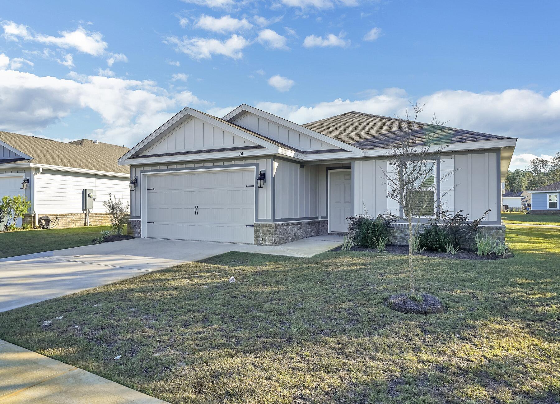 10 Riverwalk Crossing Freeport, FL 32439 - Photo 2 of 35 a view of a house with backyard and garden