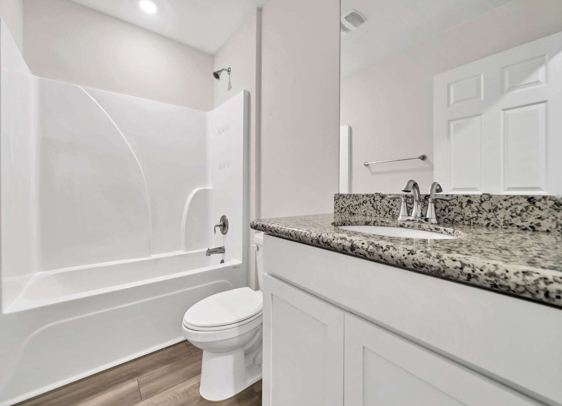 10 Riverwalk Crossing Freeport, FL 32439 - Photo 23 of 35 a bathroom with a granite countertop sink toilet and shower