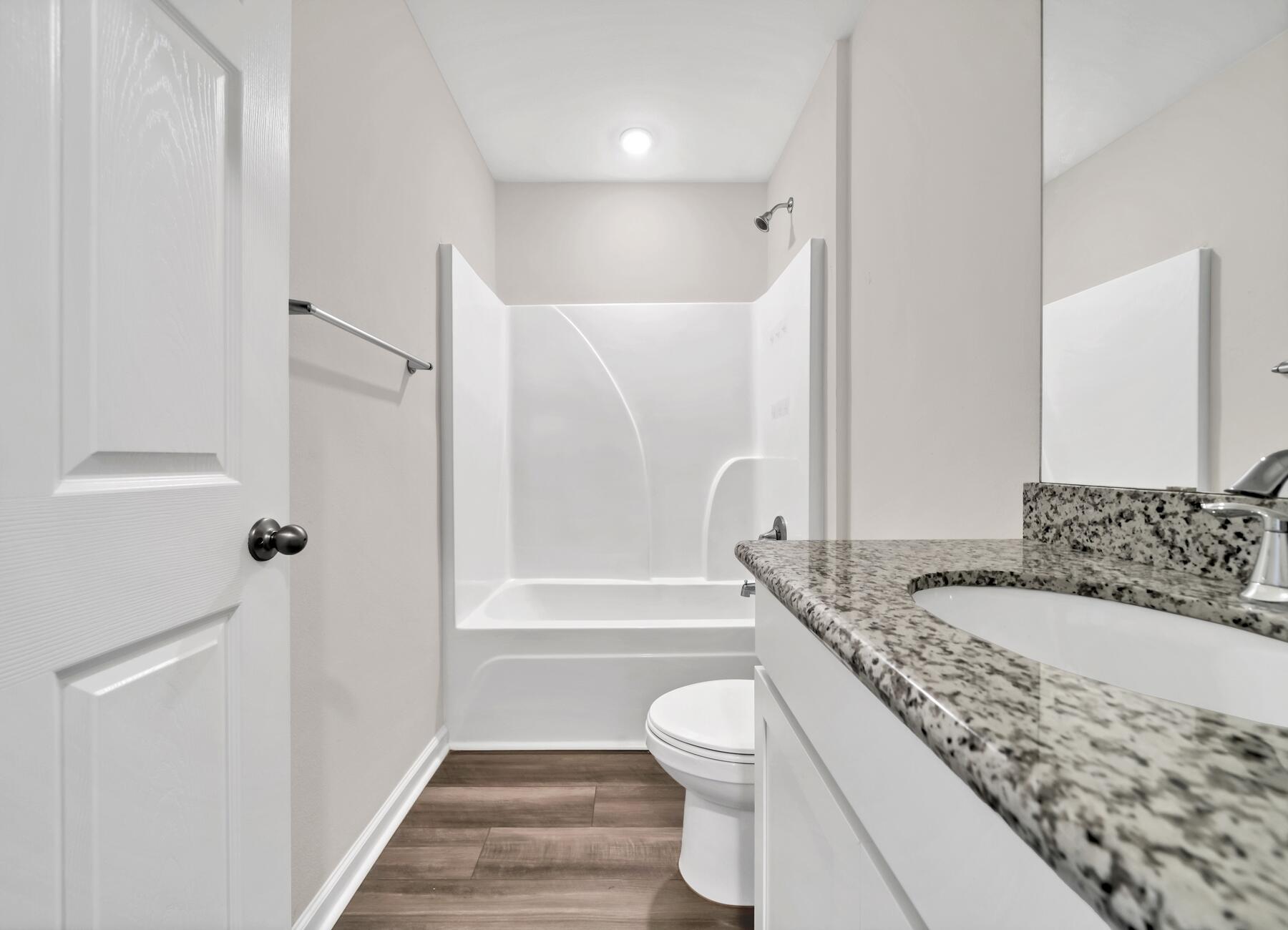 10 Riverwalk Crossing Freeport, FL 32439 - Photo 24 of 35 a bathroom with a granite countertop sink toilet and shower
