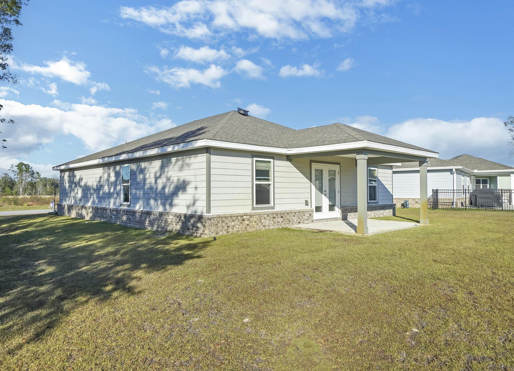10 Riverwalk Crossing Freeport, FL 32439 - Photo 3 of 35 a front view of a house with a yard