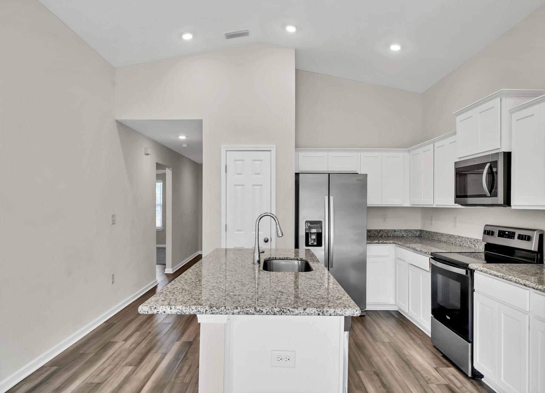 10 Riverwalk Crossing Freeport, FL 32439 - Photo 6 of 35 a kitchen with stainless steel appliances granite countertop a sink stove and refrigerator