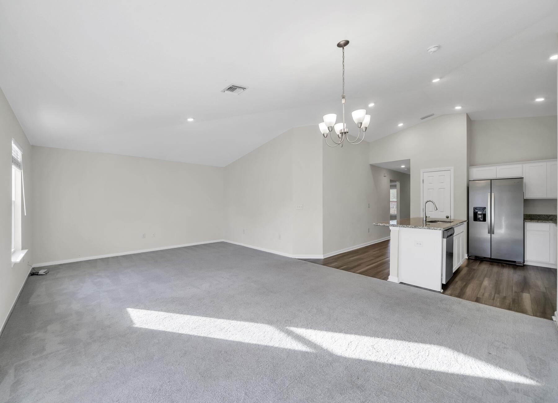10 Riverwalk Crossing Freeport, FL 32439 - Photo 9 of 35 a view of a livingroom with kitchen and chandelier