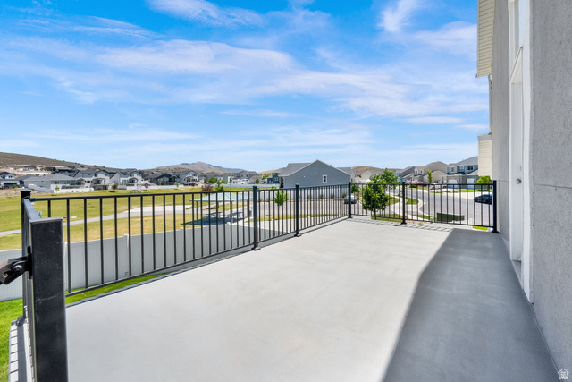 1857 Thunder Gulch Road Eagle Mountain, UT 84005 - Photo 43 of 50 Spacious upper-level deck featuring a concrete surface and black metal railings