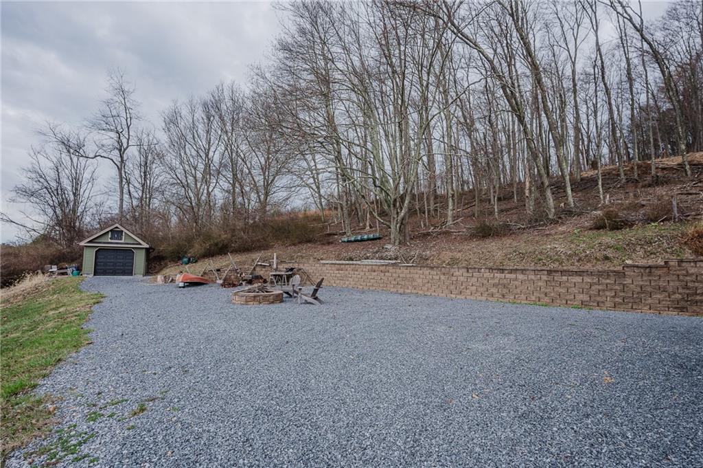 143 Chimney Ridge Road Bedford, PA 15522 - Photo 12 of 50 a front view of a house with a yard and parking space