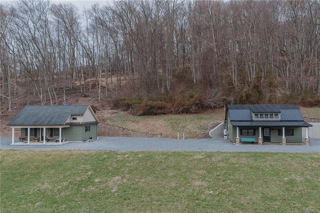 143 Chimney Ridge Road Bedford, PA 15522 - Photo 2 of 50 a front view of a house with a garden