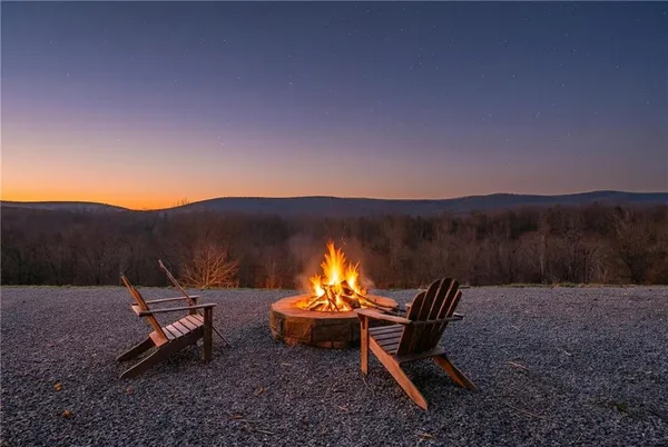 a view of a backyard with sitting area