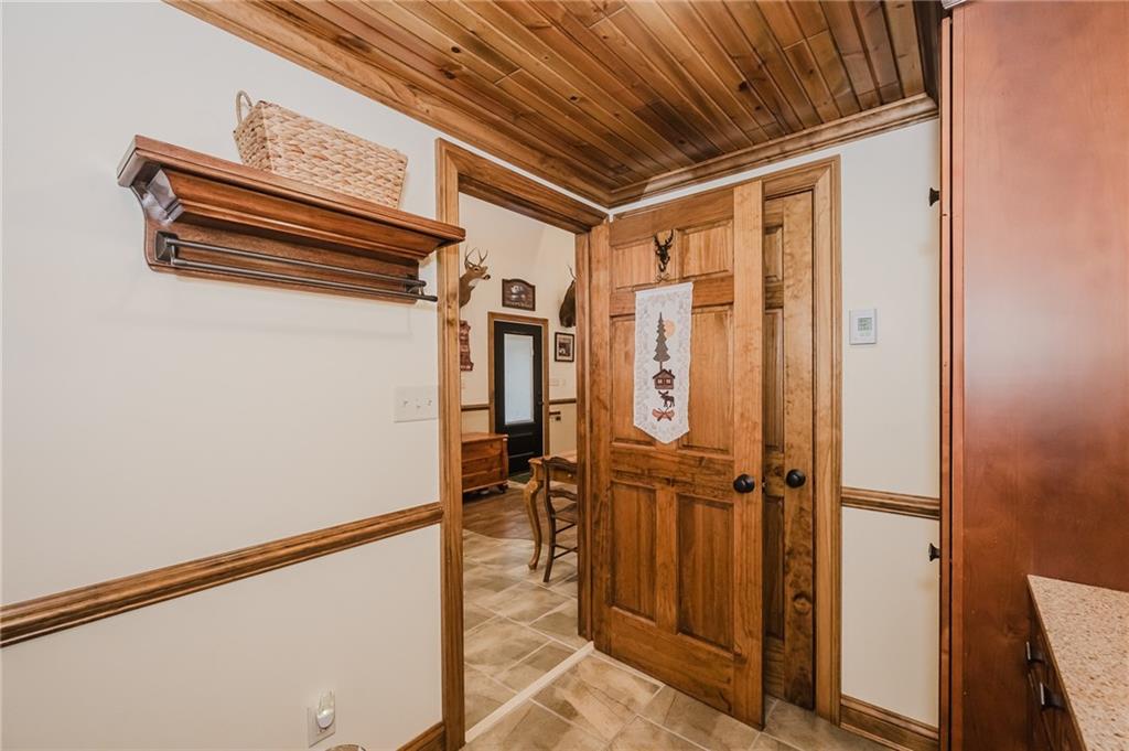143 Chimney Ridge Road Bedford, PA 15522 - Photo 33 of 50 a view of a room with wooden walls and glass door