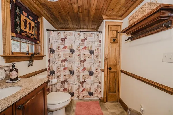 a view of a livingroom with walk in closet and bedroom