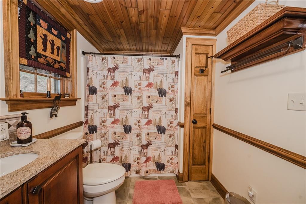 143 Chimney Ridge Road Bedford, PA 15522 - Photo 34 of 50 a bathroom with a granite countertop sink toilet and shower
