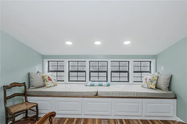 a view of a livingroom with furniture and wooden floor