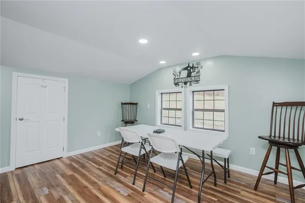a bedroom with a bed a table and chair