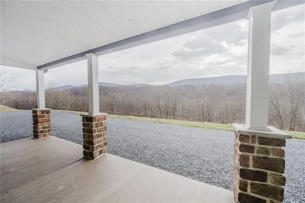 a view of an empty room with windows