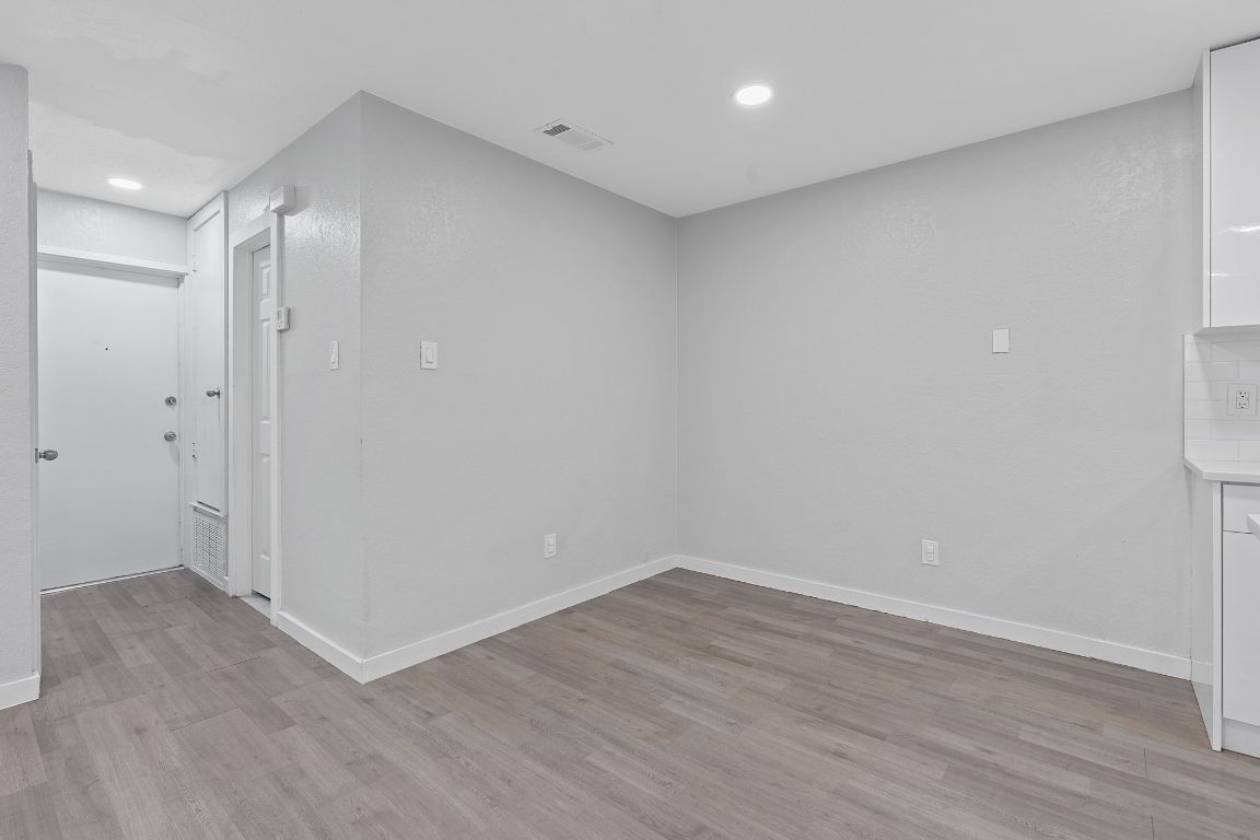 16131 Stoneham Circle Pflugerville, TX 78660 - Photo 12 of 19 wooden floor in an empty room
