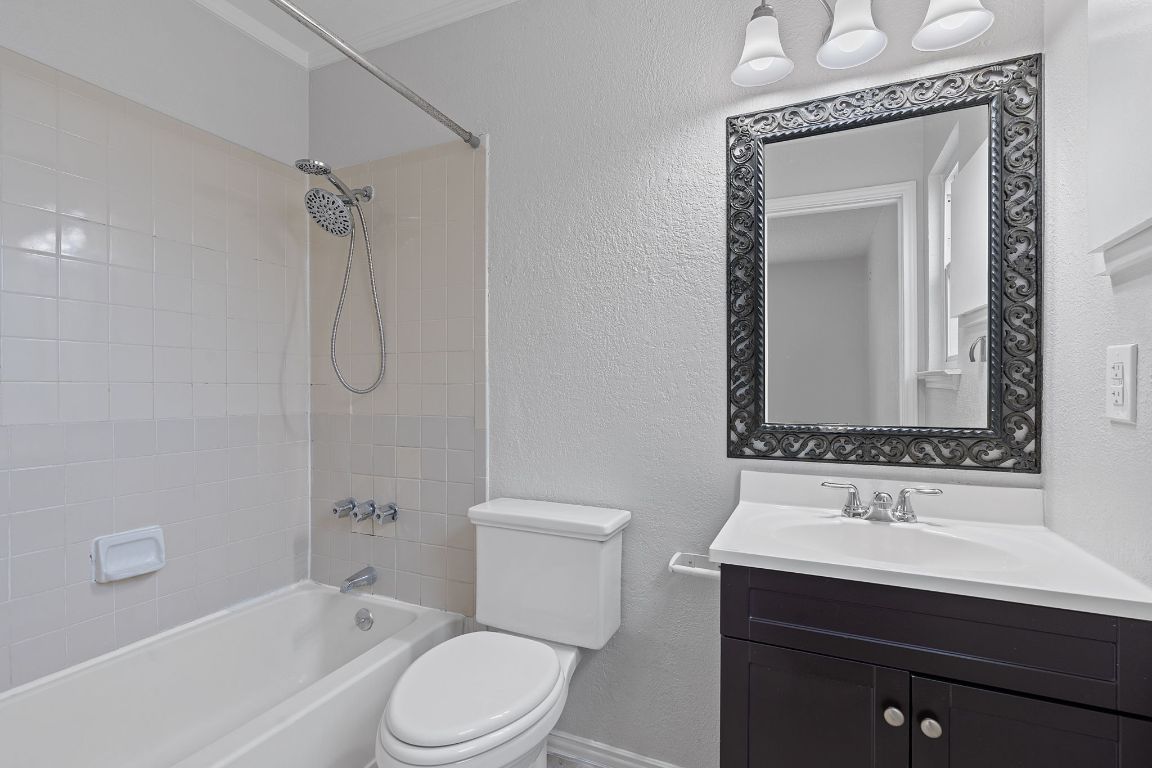16131 Stoneham Circle Pflugerville, TX 78660 - Photo 10 of 19 a bathroom with a sink a toilet and shower