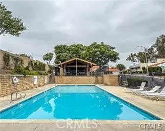 a view of a swimming pool with an outdoor seating