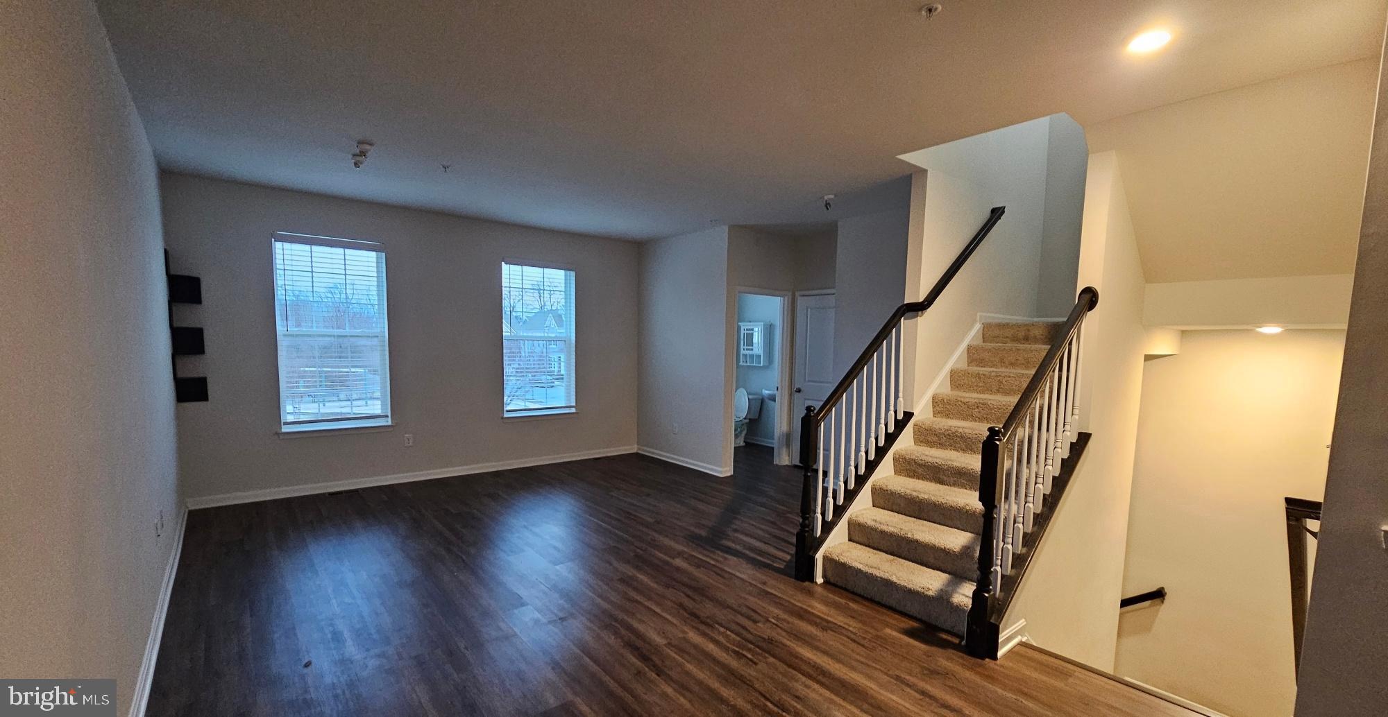 5147 Constitution Street Frederick, MD 21703 - Photo 11 of 23 a view of wooden floor and windows in a room